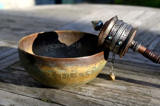 Meditation objects on a wooden table outdoor