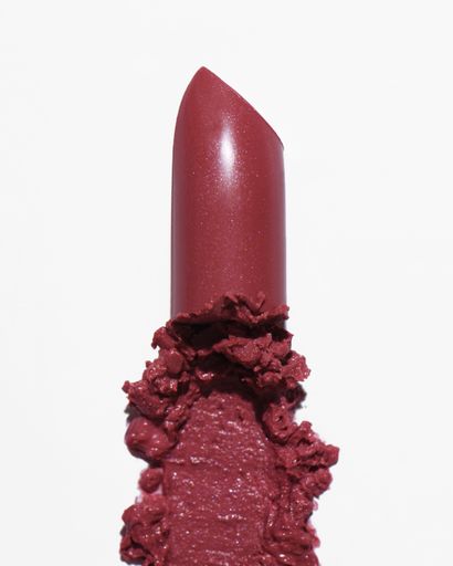 A closeup shot of a pink lipstick isolated on white background