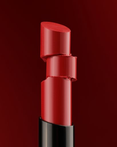 A closeup shot of a red lipstick isolated on white background