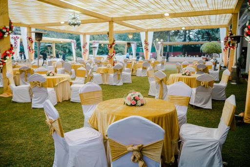 A beautiful view of decorated tables and chairs on a wedding day