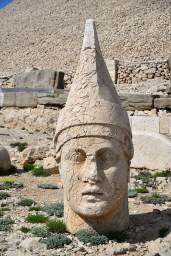 A vertical shot of an ancient statue on Mount Nemrut in Turkey
