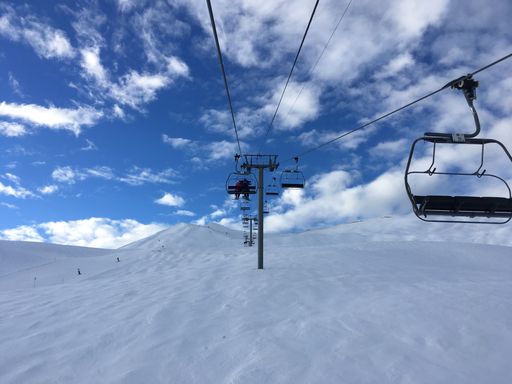 The beautiful mountain slopes with chairlift on a winter cloudy day