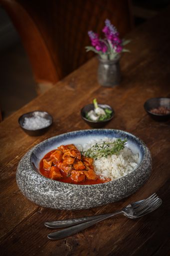 A vertical shot of the traditional Bulgarian dish Vinen Kebap with meat and rice