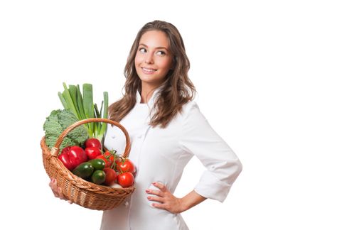 Gorgeous young brunette chef woman isolated on white background.