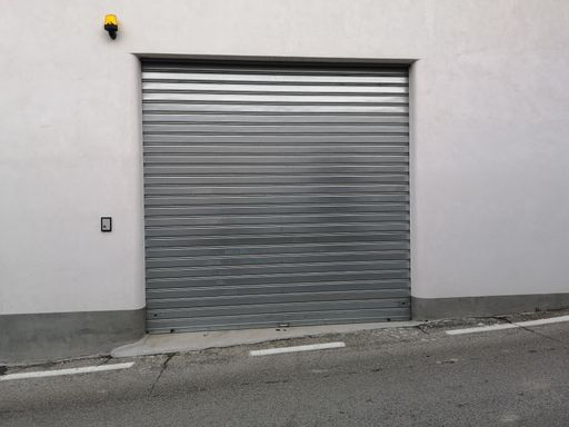 A gray metallic shutter garage gate