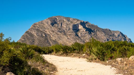 A mesmerizing view of a beautiful mountainous landscape against a blue sky