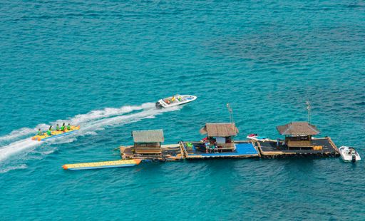 An aerial view of Boracay Island in the Philippines, with a variety of boat activities taking place