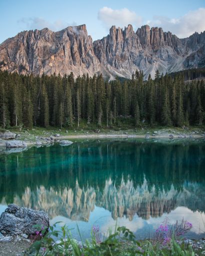 a vertical shot of the Karersee alpine lake in  Welschnofen Italy