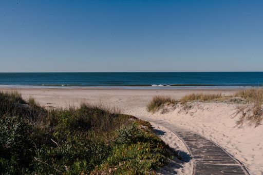 A narrow gray pathway in Santa Lucia del Este Canelones beach in uruguay