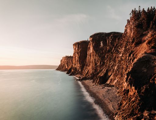 A beautiful view of the coastline with cliffs in sunny weather
