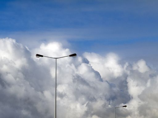 A scenery of the white fluffy clouds coming together in the sky