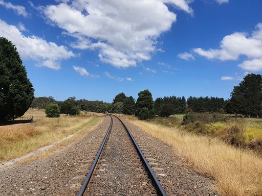 A fantastic shot of a long railroad through the forest in Australia
