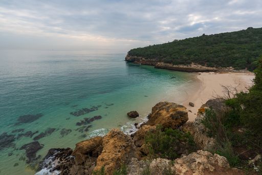 Paradise idylic Coelhos beach with turquoise water in Arrabida park, in Portugal