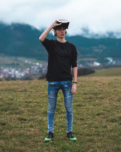 Teenager Lost in a Digital World - Virtual Reality, Futuristic Modern Recreation Technology Concept - Playing Games in Future.