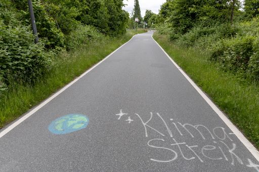 An empty bike lane in Germany with the words 'Klima Streik' visible on the ground