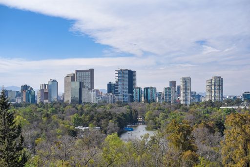 An aerial view of Mexico city tall building exterior scene from Chapultepec lake In Mexico