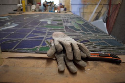 Work table in a vitrail workshop where stained decorative windows are made