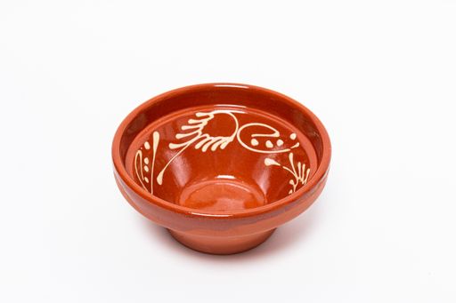 A closeup shot of a brown clay vase isolated on a white background
