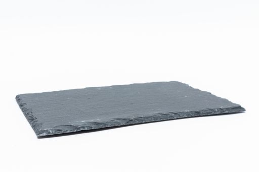 A closeup shot of a black stone plate isolated on a white background
