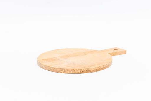 A closeup shot of a wooden chopping board isolated on a white background