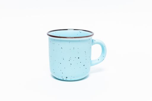 A closeup shot of a metal blue mug isolated on a wh