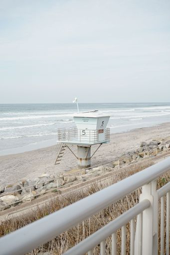 A beautiful view of a lifeguard tower on the beach