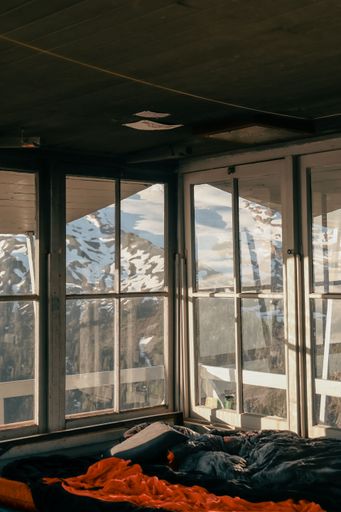 A beautiful view of a snowy mountain from a hotel room