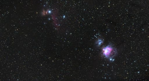 A stunning shot of a night sky filled with a cluster of vibrant blue and purple stars
