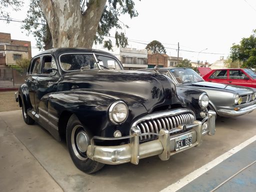 Lanus, Argentina - Sept 25, 2022: Old black 1940s Buick Eight Special four door sedan by GM in a park. AAA 2022 classic car show.