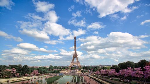 Beautiful cityscape of Paris, France under cloudy sky with Eiffel tower in background