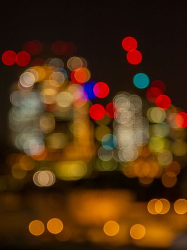 A vertical shot of city lights in bokeh effect