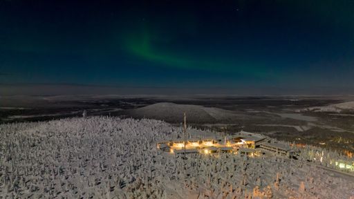 Northern lights, moon light, winter night in Syote, Finland - aerial view