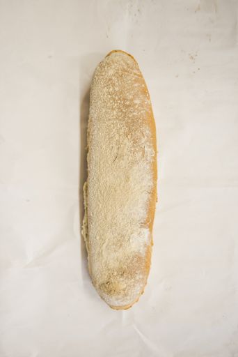 An overhead shot of freshly baked white bread on an isolated background