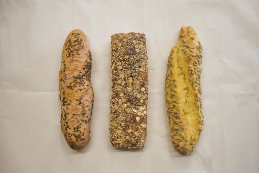 An overhead shot of freshly baked breads of different types on an isolated backgroun