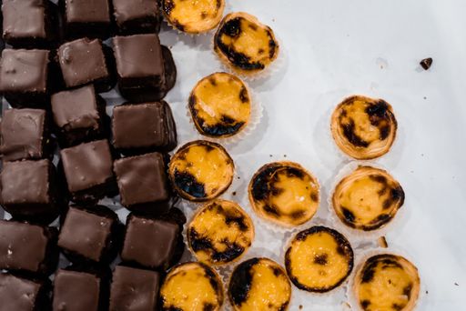 An overhead shot of two types of tasty desserts on a white surface