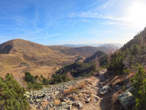 A picturesque view of a nature trail snaking its way down the side of a mountain, Pfannock, Carinthia, Austria