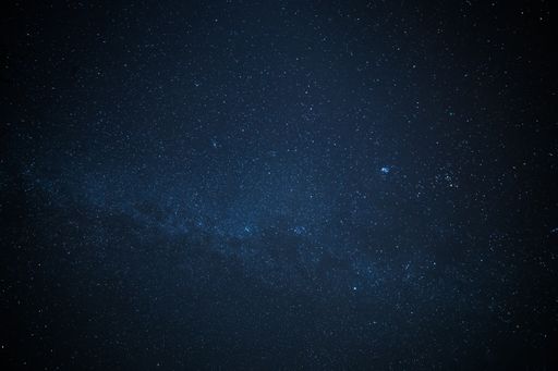 A low-angle shot of a starry night sky