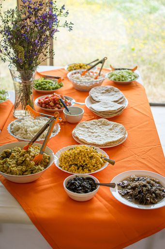 A vertical shot of various types of vegan food on the table