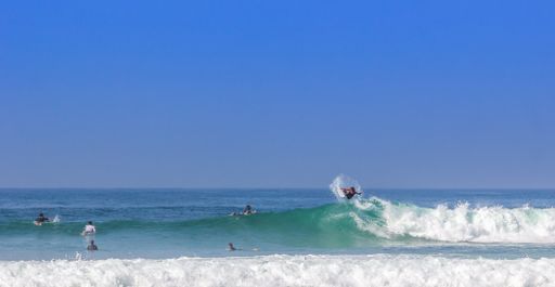 A surfer on beautiful sea waves on a sunny day