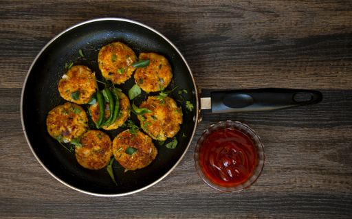 A top view of the patties on a pan on the table