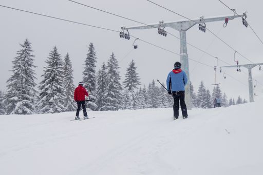 A chilling view of skiers on the mountain during winter