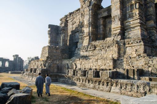 The ruins of the Martand Sun Temple under the sunlight and a blue sky in India