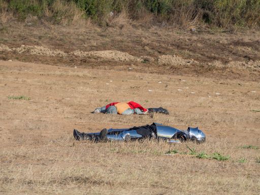 Two killed medieval soldiers lying in a battlefield