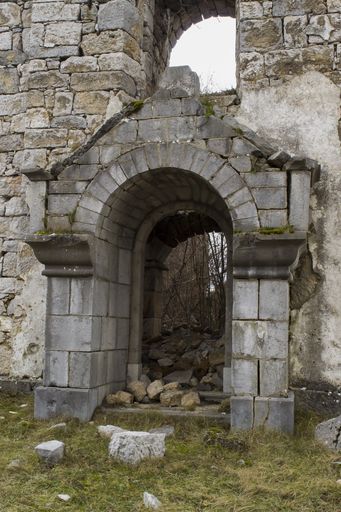 A vertical shot of the entrance of an old church ruins in Deringaj, Croatia
