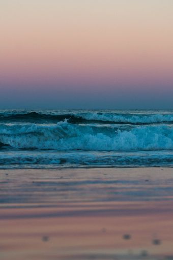 A vertical shot of a beautiful sea during the sunset