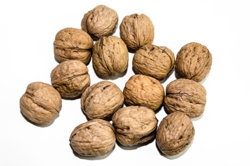 A closeup shot of walnuts isolated on white background