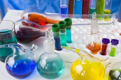 A closeup of colorful liquid chemical elements on the laboratory table