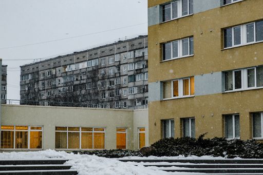 A beautiful shot of residential buildings with illuminated windows