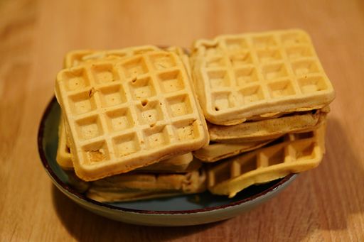 A high angle shot of fresh homemade waffles on a plate