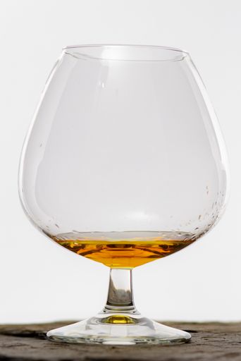 A glass of cognac isolated in the white background